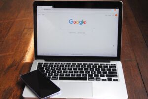 a laptop with a cell phone Rank Higher on Google
